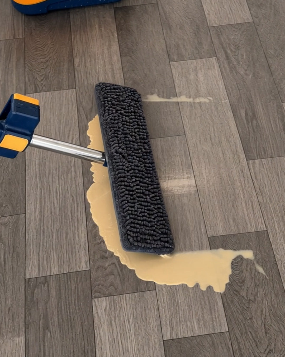 Squeegee edge clears spills.