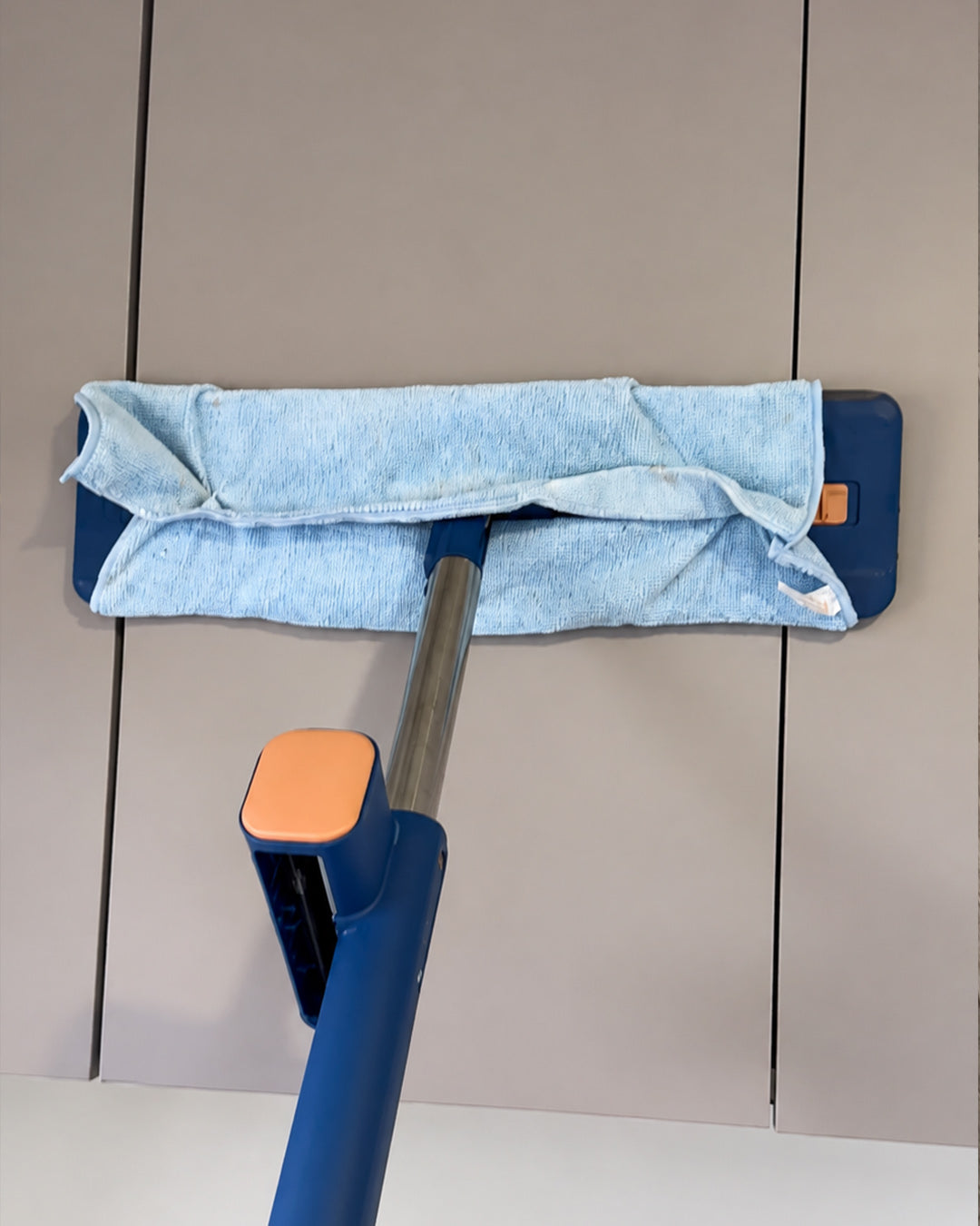 Wipe holder runs it dry over cabinets, skirting and floors.